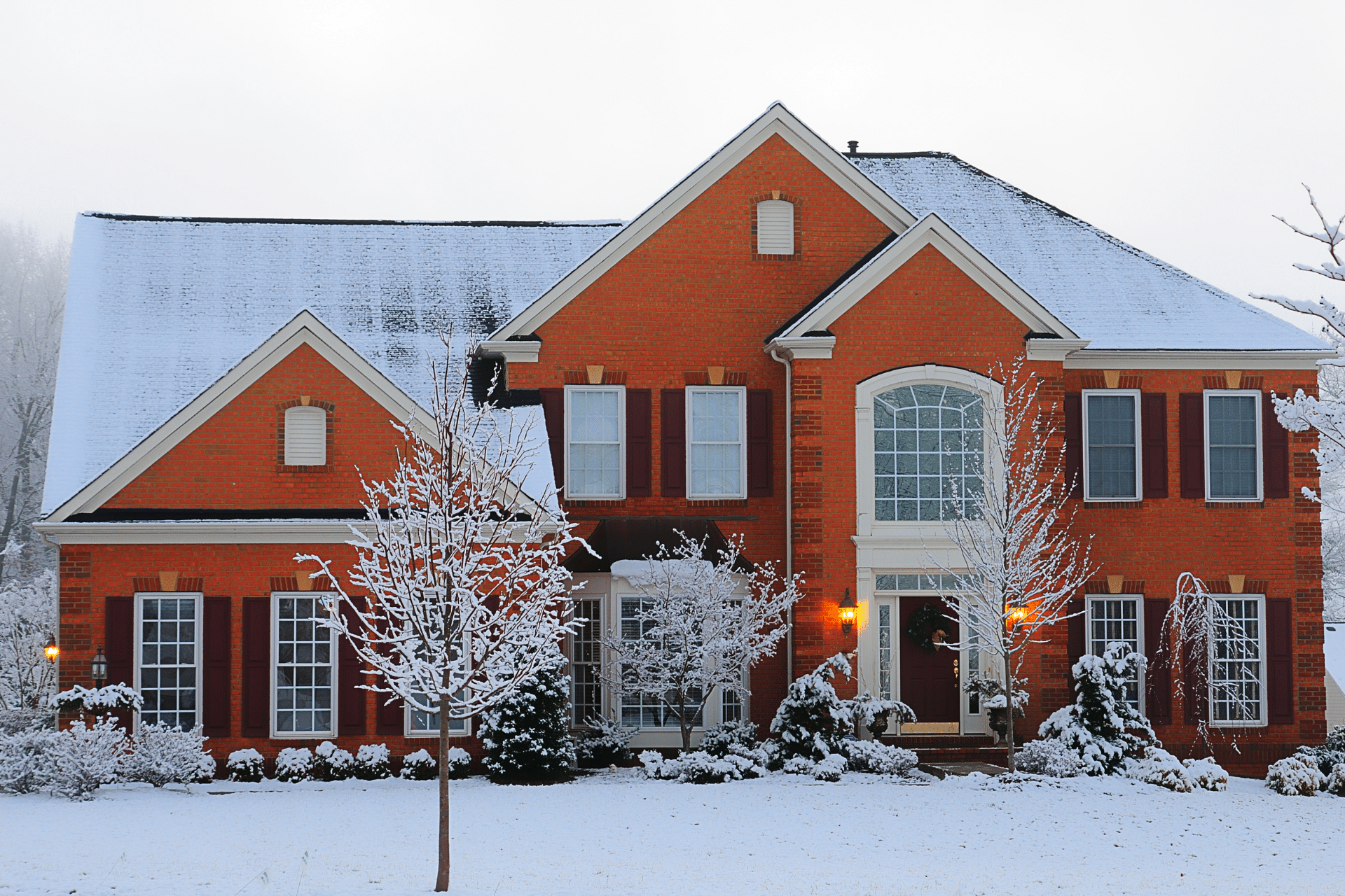 Traditional brick house in the snow